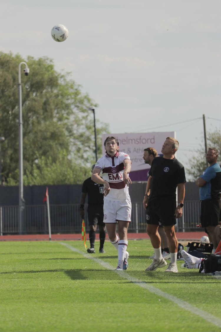 Football player taking a throw-in from the touchline